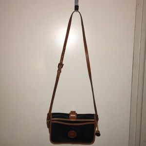 Dooney and Bourne purse, blue leather, brown trim.